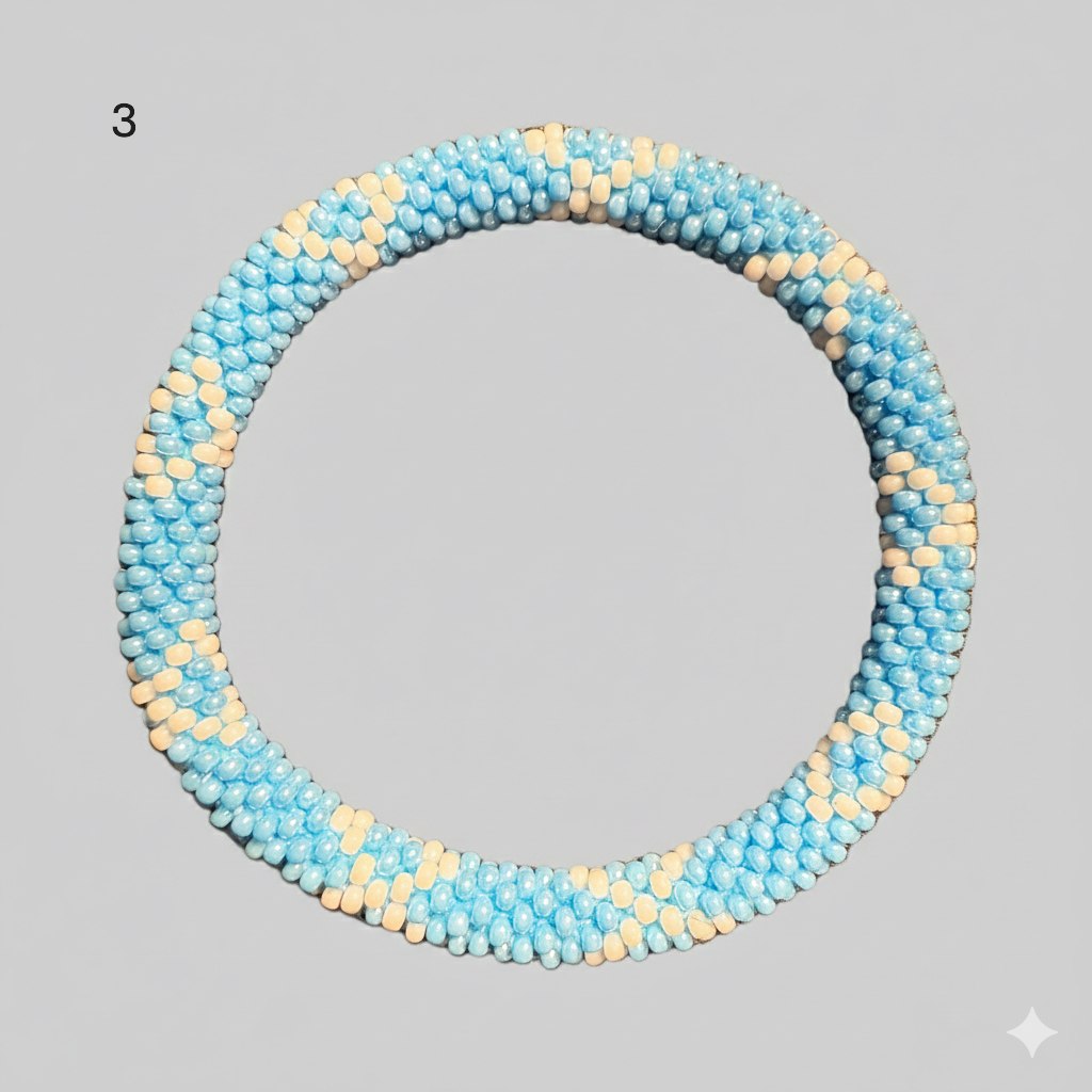 A selection of beaded bracelets from Nepal in orange and light blue 