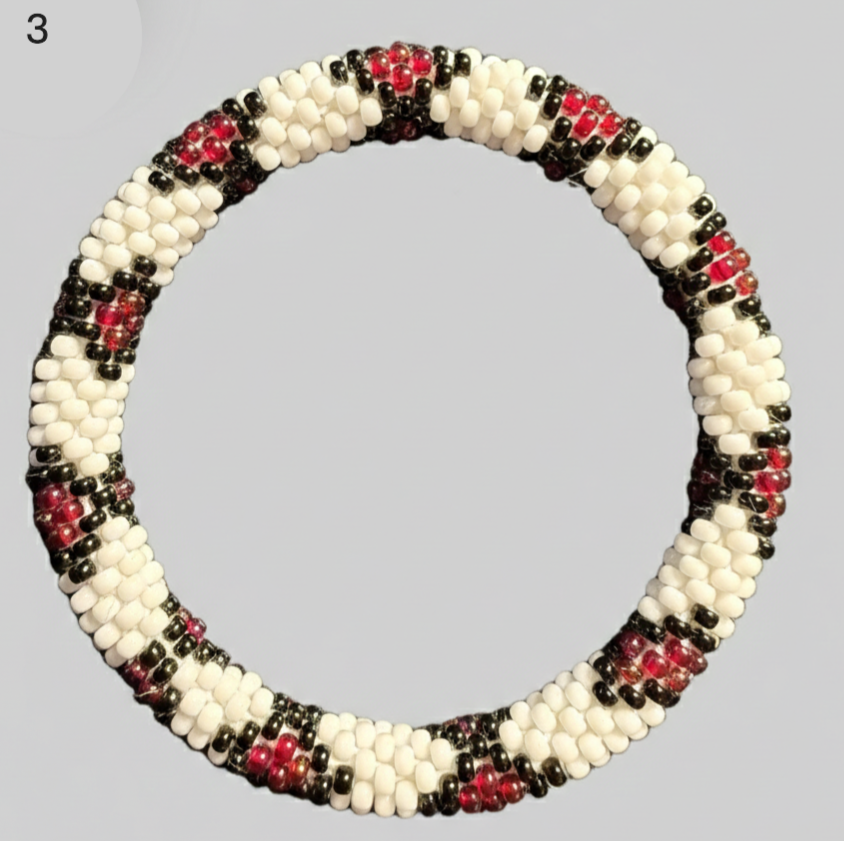A selection of beaded bracelets from Nepal, handmade in black and red