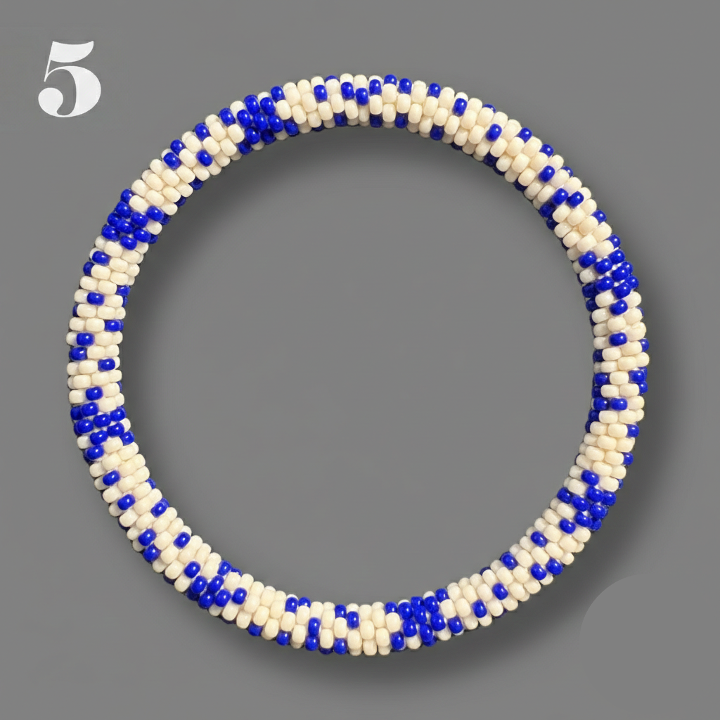 A selection of blue and red beaded hoop bracelets, handmade from Nepal.