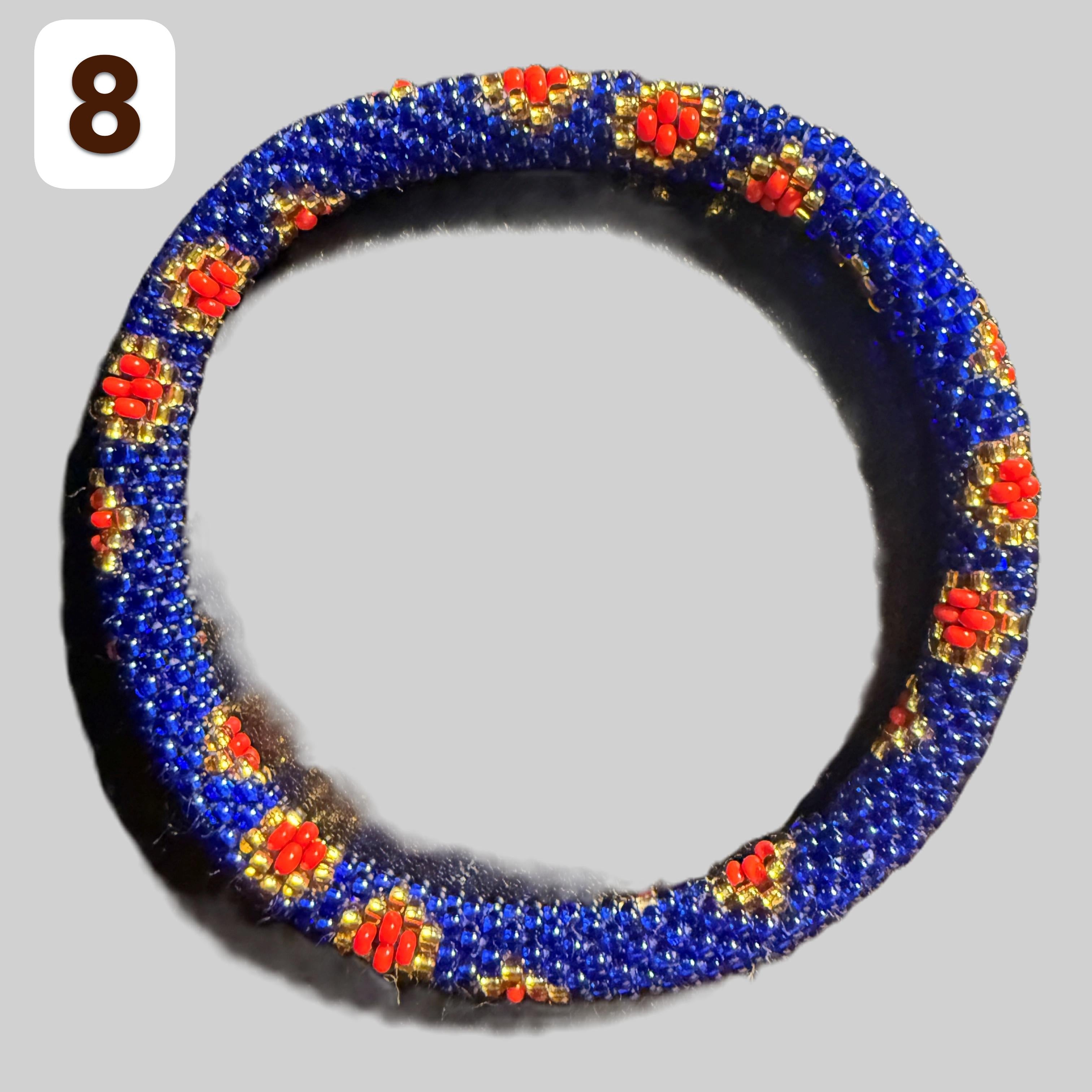 A selection of blue and red beaded hoop bracelets, handmade from Nepal.