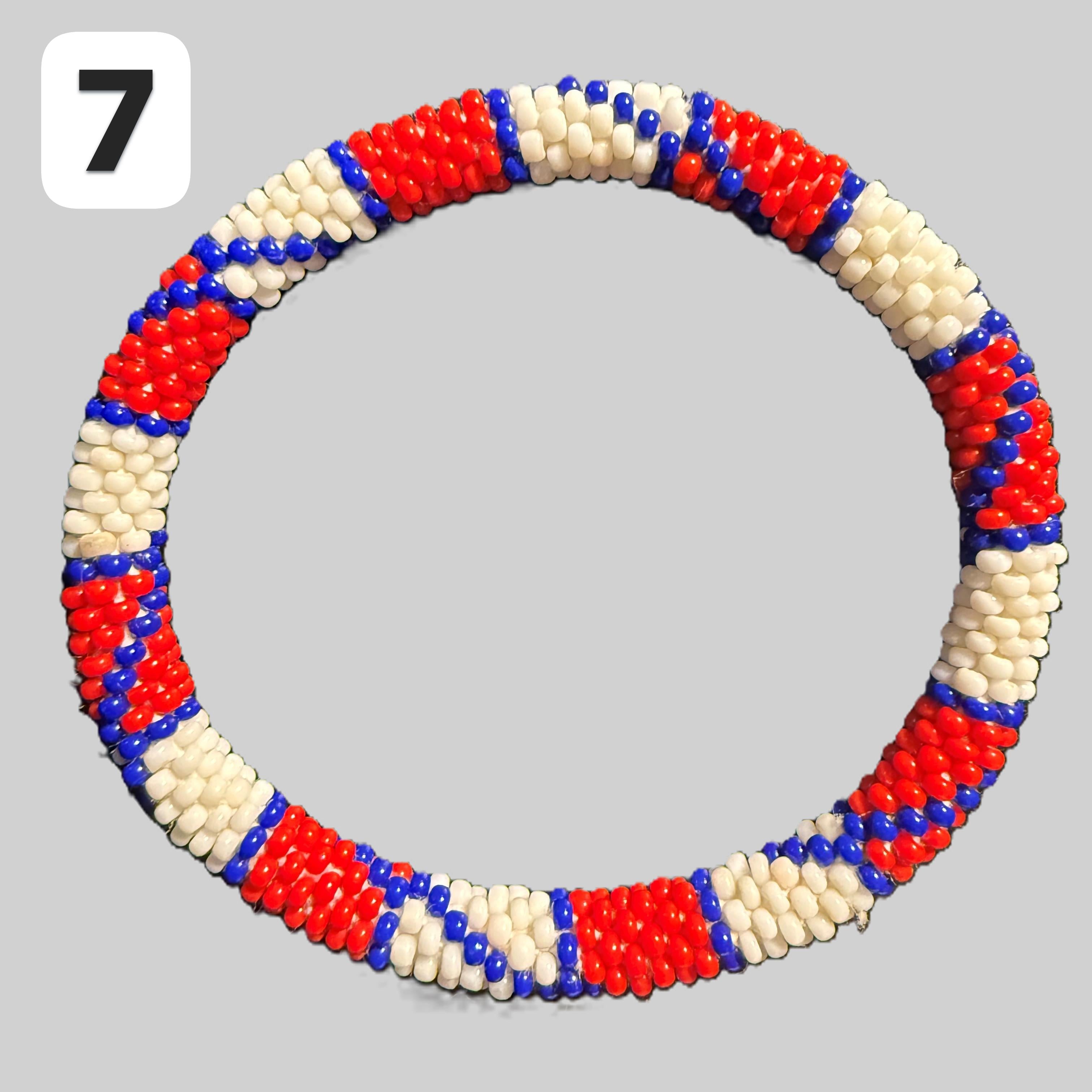 A selection of blue and red beaded hoop bracelets, handmade from Nepal.