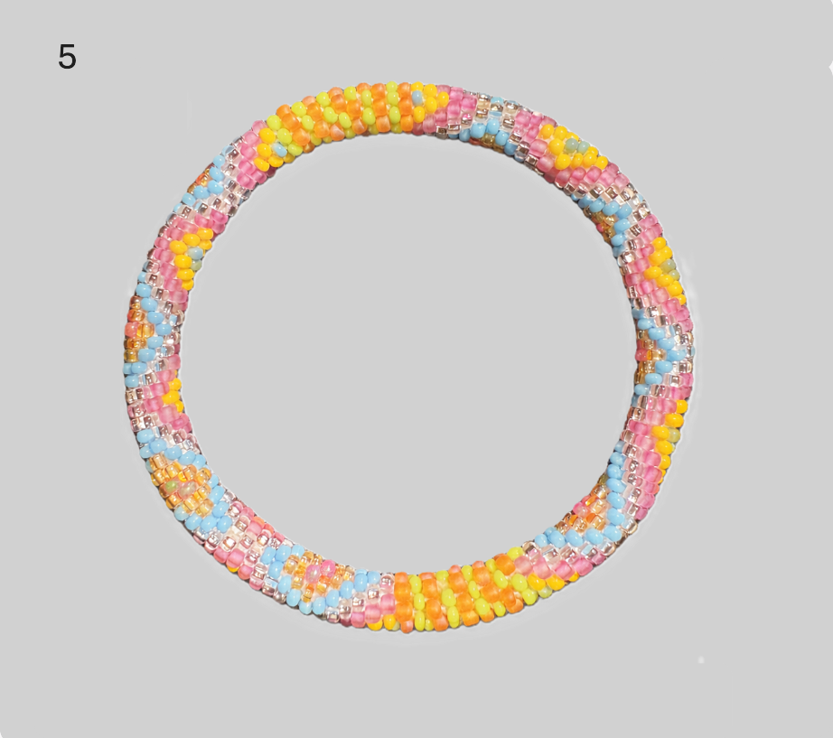 A selection of beaded bracelets from Nepal in orange and light blue 